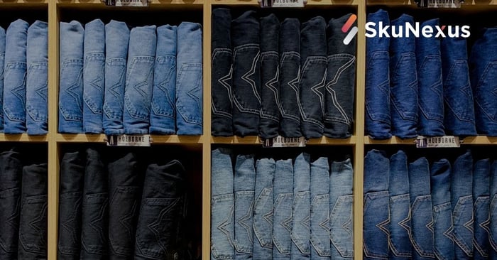 Stock of jeans in inventory on a wall